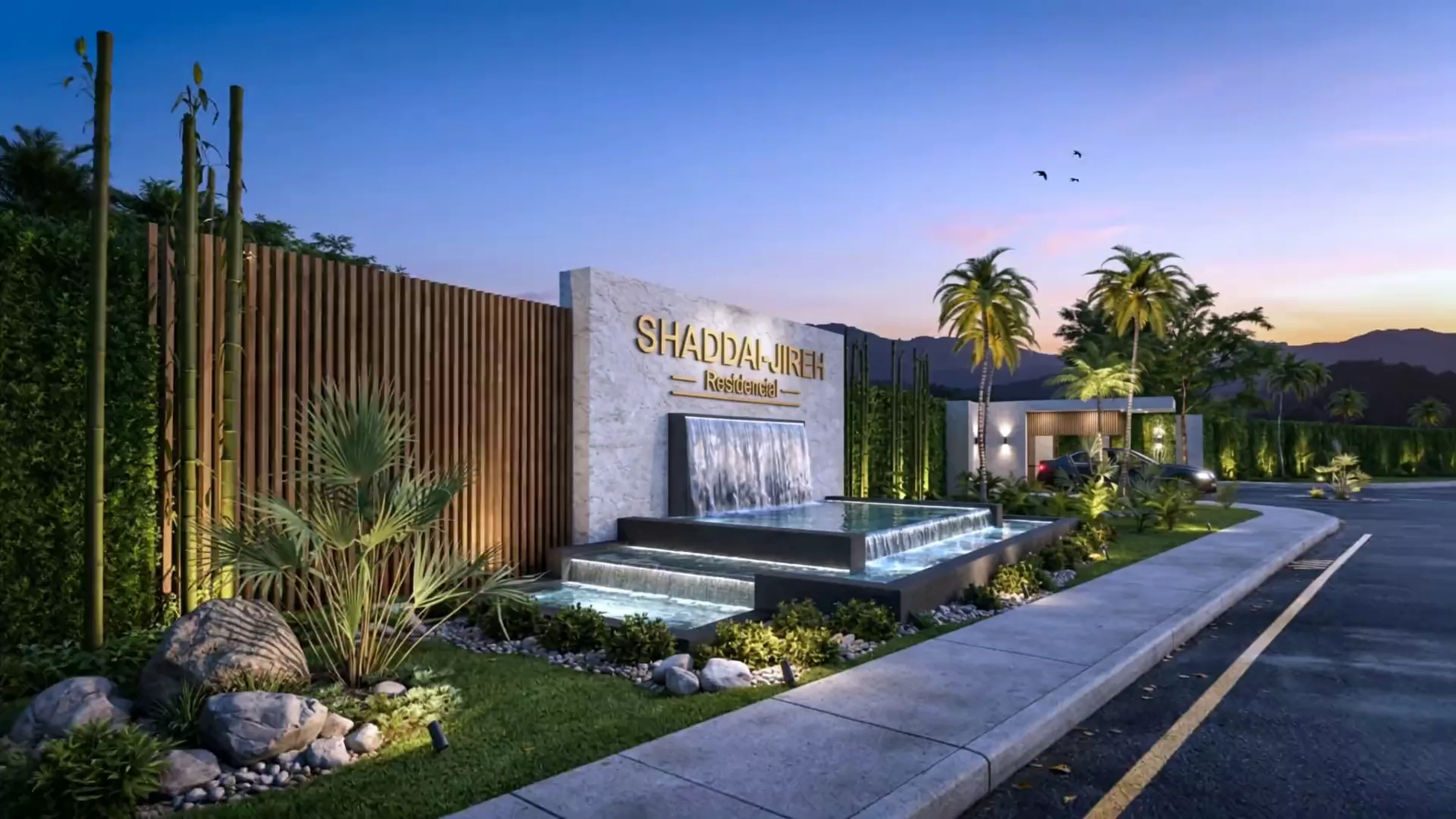 Entrada principal de Shaddai-Jireh Residencial al anochecer, con letrero iluminado y cascada