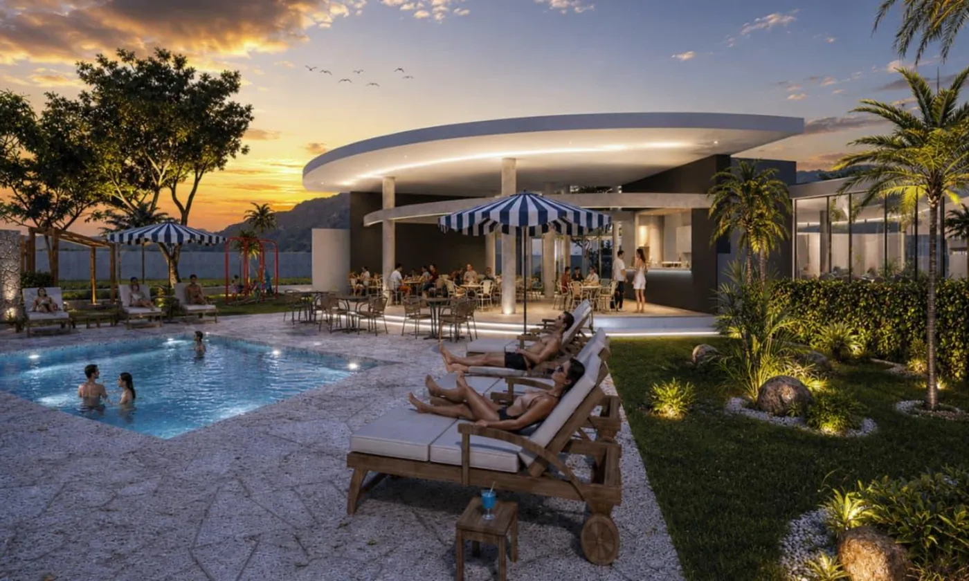 Piscina y terraza del club house al atardecer