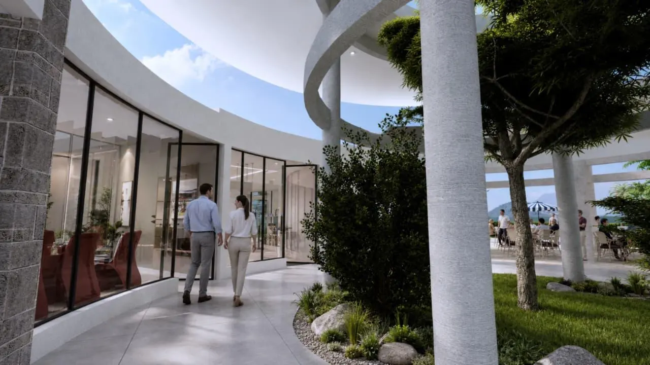 A curved corridor looking out to the terrace and garden